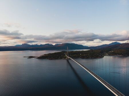 Aerial view of a Halogaland suspension bridge which crosses the Rombaksfjorden in Narvik Municipality in Nordland county, Norway, part of the European Route E6 highwayの写真素材