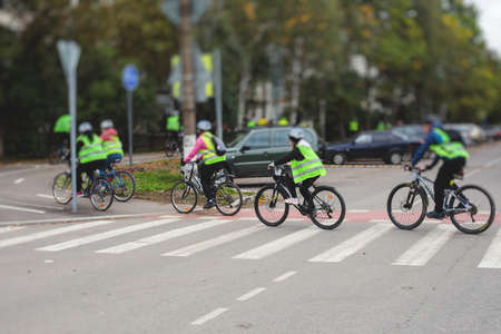 View of bicycle race in the city streets, bike race with a group mass of cyclist athletes in cycling...