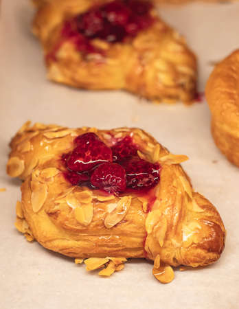 Pastry, selection assortment of different bakery, with croissant, swiss rolls, cake, eclair and others in a basket or a plate, baked desserts, catering or cafe banquet bakery tableの写真素材