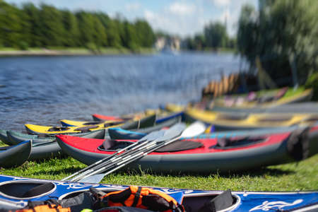 A process of kayaking in the city river canals, with colorful canoe kayak boat paddling, process of...