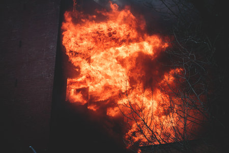 Massive large blaze fire in the city, brick factory building on fire, hell major fire explosion...
