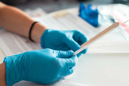 Process of coronavirus testing examination at home, COVID-19 swab collection kit, test tube for...