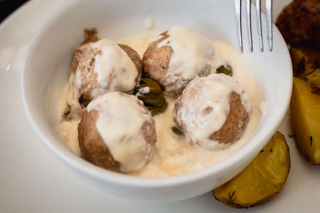 View of Koenigsberger klops, a specialty traditional german style cooked meat balls in Kaliningrad,...