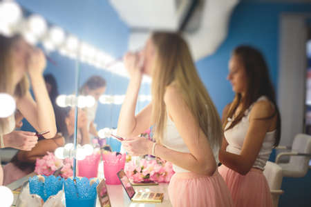 Happy young stylish multiethnic girls having fun during bachelorette bridesmaids party, group of...