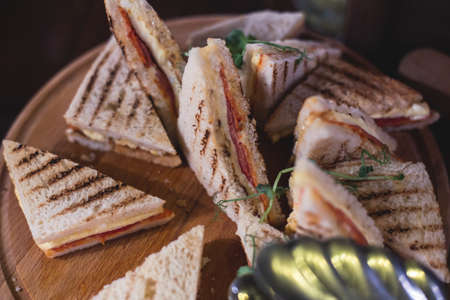 Beautifully decorated catering banquet table with different food snacks and appetizers on corporate christmas birthday party event or wedding reception celebrationの写真素材