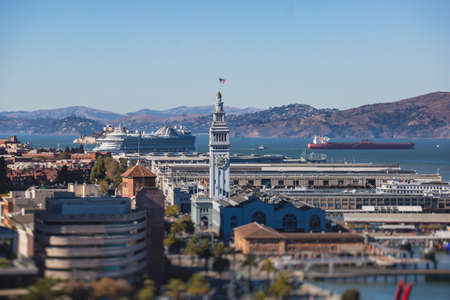 Aerial vibrant view of San Francisco port, with clock tower and the Ferry Building Marketplace, California, United States, seen from Bay Bridge, sunny dayの写真素材
