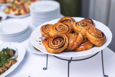 Set of coffee break in the hotel during conference meeting, with tea and coffee catering, decorated catering banquet table with variety of different pastry bakery, with croissants and cookiesの写真素材