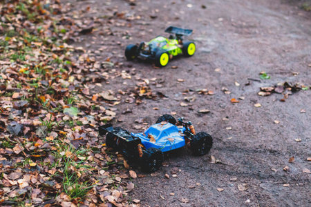 Radio controlled buggies cars race, process of rc wireless model toy car rally off road outdoor racing competitionの写真素材