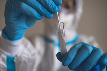 Process of coronavirus PCR antigen testing examination by nurse medic in laboratory lab, COVID-19...