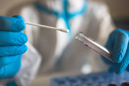 Process of coronavirus PCR antigen testing examination by nurse medic in laboratory lab, COVID-19...