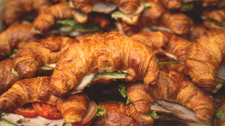 Set of coffee break in the hotel during conference meeting, with tea and coffee catering, decorated catering banquet table with variety of different pastry and bakery, with a croissants and cookiesの写真素材