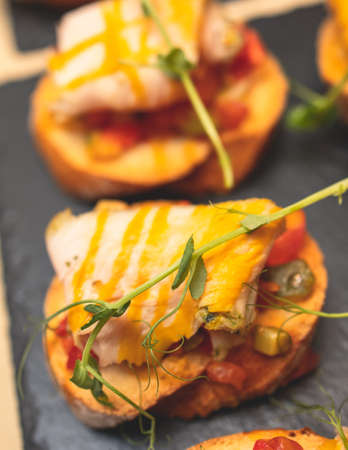 Catering table, beautifully decorated banquet with variety of with different food snacks and appetizers on corporate birthday party event or wedding celebration, delicatessen settingの写真素材