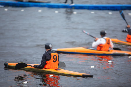 Canoe polo match, two teams play kayak polo game outdoor competition in the lake river, challenging...