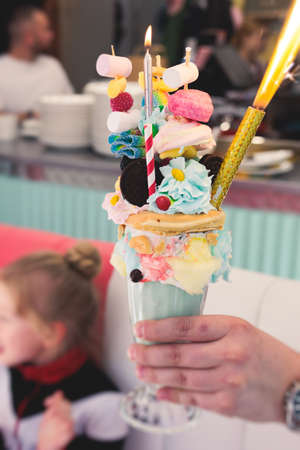 Over shake and freak shake, process of cooking extreme colorful milkshakes on a kids birthday party...