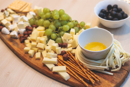 Catering table, beautifully decorated banquet table with variety of different food snacks, sandwiches, croissants and appetizers on party event or celebration, delicatessen setting, coffee breakの写真素材