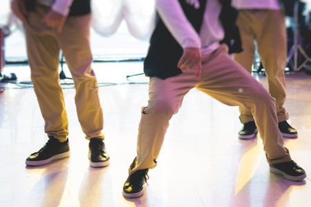 Group of hip-hop dancers performance on a stage, modern contemporary street dance with break dancing in studio, hip hop dance training  in a ballroom, sneakers close upの写真素材