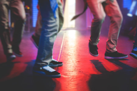 Group of hip-hop dancers performance on a stage, modern contemporary street dance with break dancing in studio, hip hop dance training  in a ballroom, sneakers close upの写真素材