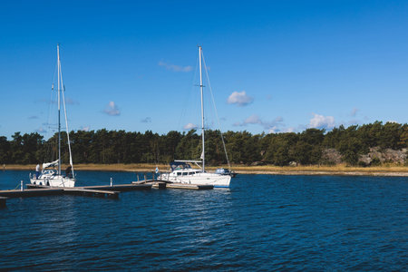Archipelago National Park landscape, Southwest Finland, with islands, islets and skerries, Saaristomeren kansallispuisto, summer sunny day, view from shuttle ship ferry in the Archipelago Seaの写真素材