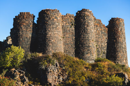 Beautiful sunny view of Amberd fortress, Mount Aragats with horse pasturing, Aragatsotn, Armenia in summer dayの写真素材
