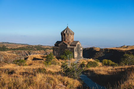 Beautiful sunny view of Amberd fortress, Mount Aragats with horse pasturing, Aragatsotn, Armenia in...