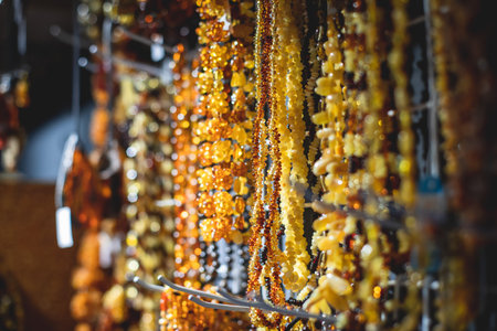 Variety assortment of souvenirs and jewelery made of amber, traditional tourist souvenirs and gifts from Kaliningrad, Russia, in local vendor souvenir shopの写真素材