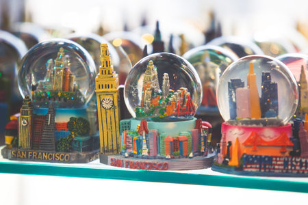 View of traditional souvenirs from San Francisco, with fridge magnet, crystal balls and cable car miniature models in souvenir shop of Fisherman's Wharf, Californiaの写真素材