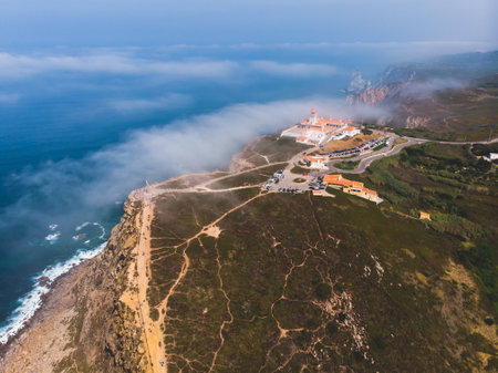Beautiful aerial vibrant view of Capo Da Roca, the most western point of Europe, Portuguese municipality of Sintra, near Azoia, district of Lisbon, Serra de Sintra, Portugal, shot from droneの写真素材