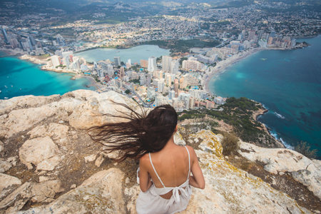 View of Calpe Calp town with Penon de Ifach mountain during the hiking to Penyal d'Ifac Natural Park, Marina Alta, province of Alicante, Valencian Community, Spainの写真素材