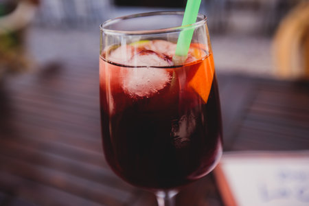 Cup of Sangria - traditional alcoholic beverage with red wine and chopped fruit served in the streets of Alicante, Valencia, Spainの写真素材