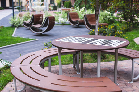 Modern european residential apartment complex yard territory, multi-story house buildings with playground and benches, contemporary scandinavian housing development, facade exterior and a courtyardの写真素材