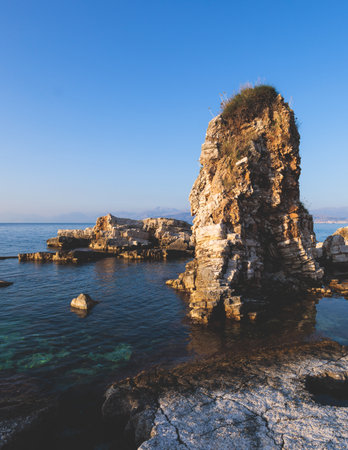 Aerial view of beach in Kassiopi village in northeast coast of Corfu island, Ionian Islands, Kerkyra, Greece in summer sunny dayの写真素材