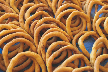 Traditional greek sesame bread rings snack pastry, Koulouri Thessalonikis with different flavors for...