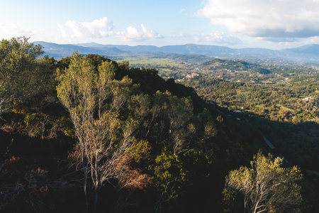 View of Kaiser's Throne observation deck lookout, Pelekas village, Corfu island, Greece, Kaiser William II summit Observatory panoramic summer view with mountains, sea and Kerkyra in the backgroundの写真素材