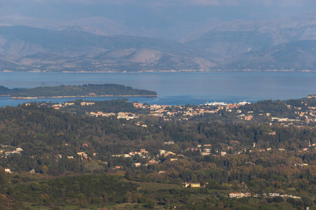 Corfu island view from Kaiser's Throne observation deck lookout, Pelekas village, Greece, Kaiser William II summit Observatory panoramic summer view with mountains, sea and Kerkyra cityの写真素材