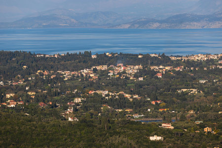 Corfu island view from Kaiser's Throne observation deck lookout, Pelekas village, Greece, Kaiser William II summit Observatory panoramic summer view with mountains, sea and Kerkyra cityの写真素材