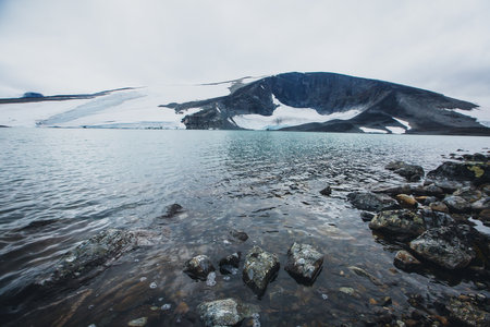 View of Galdhopiggen mountain, the highest peak and tallest mountain in Norway, Scandinavia and Northern Europe, he municipality of Lom (in Oppland), in the Jotunheimen national park mountain area.の写真素材