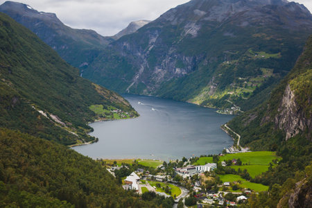 Famous Norwegian fjord, Geirangerfjord, with a Geiranger town in summer day, Norwayの写真素材