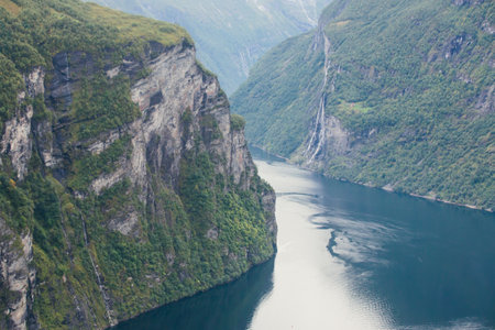 Famous Norwegian fjord, Geirangerfjord, with a Geiranger town in summer day, Norway