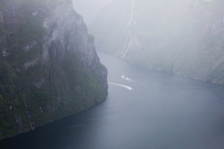 Famous Norwegian fjord, Geirangerfjord, with a Geiranger town in summer day, Norway