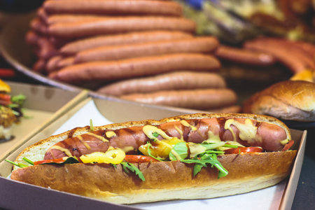 Fried baked sausages, hot dog on street food outdoor market stall in Budapest, Hungary, european street food.の写真素材