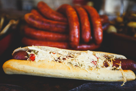 Fried baked sausages, hot dog on street food outdoor market stall in Budapest, Hungary, european street food.の写真素材