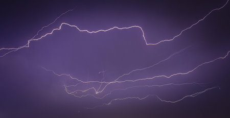 Very massive lightning thunderstorm on the city, night cityscape with strong lightning, majestic...