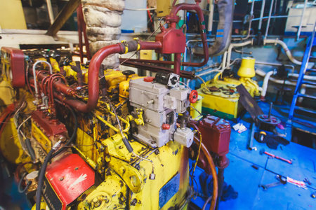 Engine Room on a cargo boat ship interior, ship's engine heavy Machinery Space - Pipes, Valves, Engines, oil rig platform interiorの写真素材