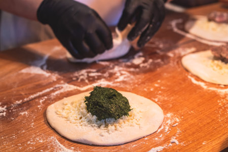 Process of cooking and serving traditional Georgian food cuisine, with pkhali khinkali dumplings and khachapuriの写真素材