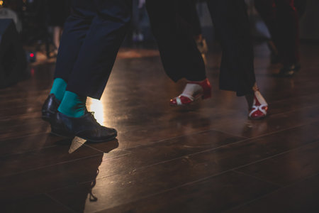 Dancing shoes of young couple dance retro jazz swing dances on a ballroom club wooden floor, close...