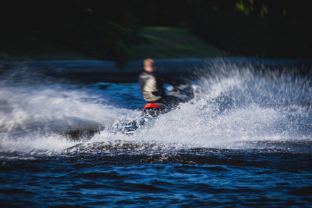 View of jet ski in motion, group of jet skiers with a big water splash, summer dayの写真素材