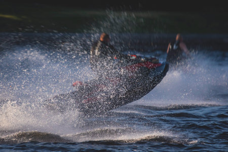 View of jet ski in motion, group of jet skiers with a big water splash, summer day