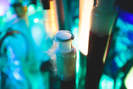 Different colored tubes and equipment during chemical experiment in labの写真素材