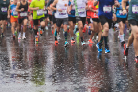 Marathon runners crowd, participants start running the half-marathon in the city streets, crowd of joggers in motion, group athletes outdoor training competitionの写真素材
