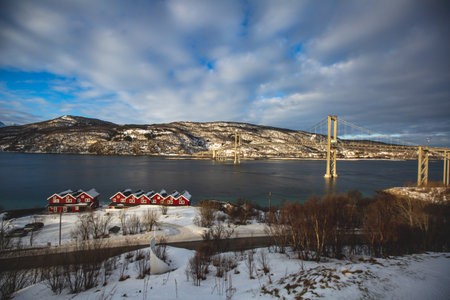 Winter view of Tjeldsund Bridge, Tjeldsundbrua in Norwegian, a suspension road bridge that crosses the Tjeldsundet strait, Troms County, nothern Norwayの写真素材